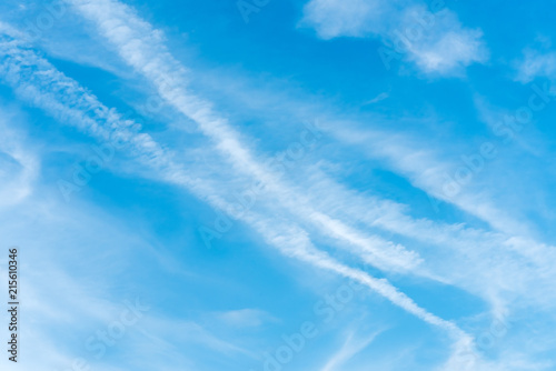 Beautiful blue sky with clouds and an air train from the plane. The texture of the sky. Background