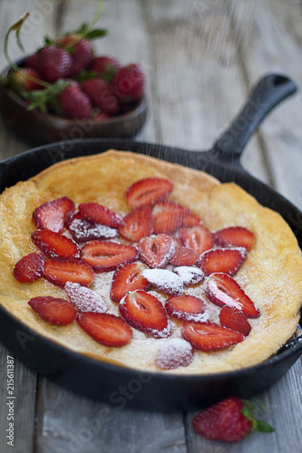 Big dutch pancake with starwberry photo