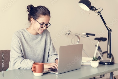 Woman using computer laptop photo