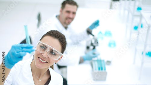 smiling scientist looking at the test results