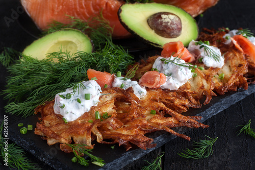 Latkes with cream cheese and salmon photo