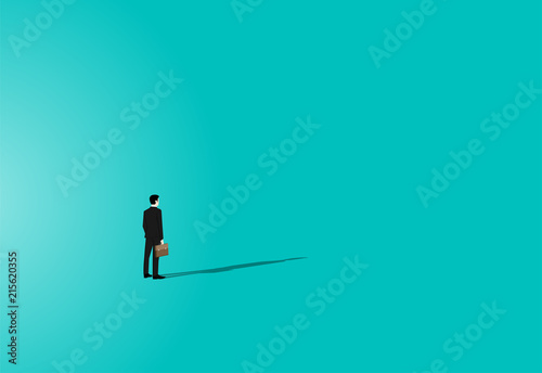 Businessman stands on color background in front of the shadow