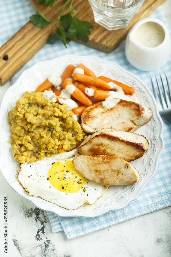 Fried turkey with lentils, egg and baby carrot Fried turkey with lentils, egg and baby carrot