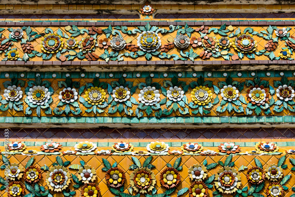 Close up beauitful mosaic tiles of large stupas in Wat Pho or Wat Phra Chetuphon Vimolmangklararm Rajwaramahaviharn is one of Bangkok's oldest temples, THAILAND