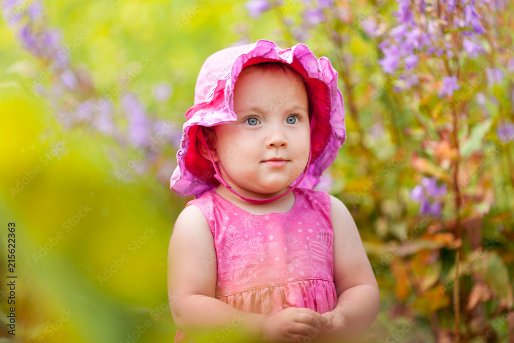 Portrait of cute little girl in summer garden Portrait of cute little girl in summer garden