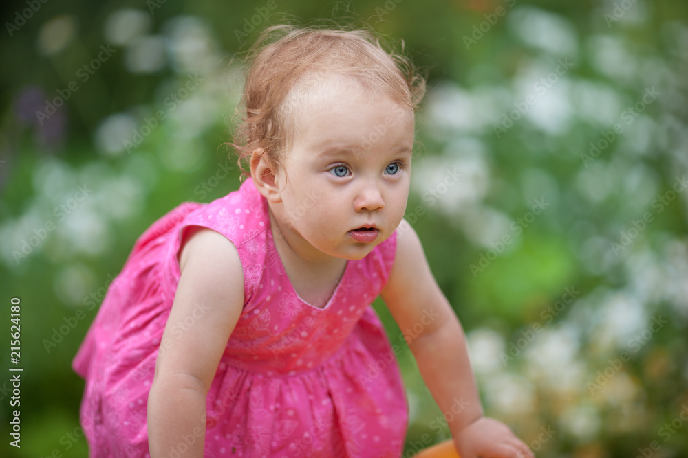 Portrait of cute little girl in summer garden Portrait of cute little girl in summer garden