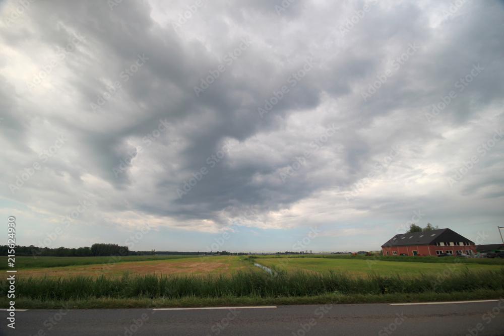 Obraz premium Cumulonimbus clouds above the Zuidplaspolder in Moordrecht, The Netherlands