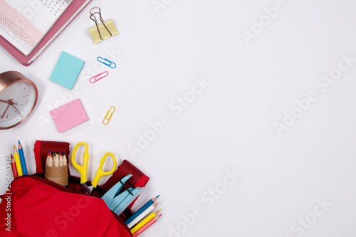 Stationeries and office supplies on white background. Flat lay. Top view with copy space. Back to school concept.