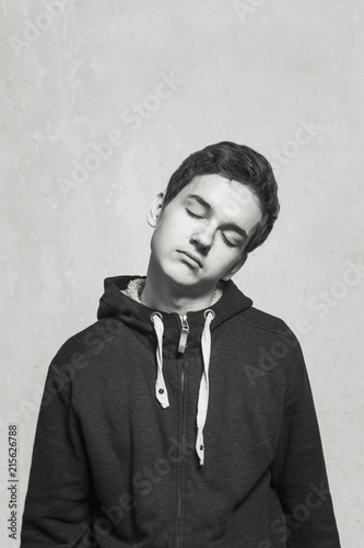 Studio portrait of a teenager boy.Emotions of a person, Hibernation, indifference.