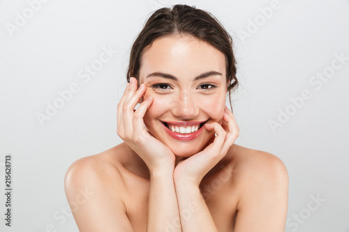 Beauty portrait of a smiling young topless woman