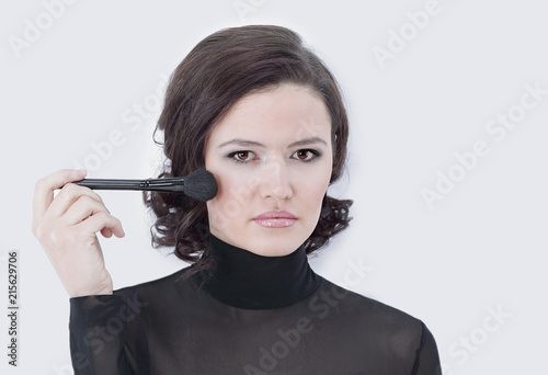 stylish young woman with brush for makeup