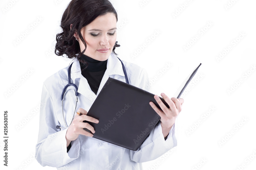 female doctor making notes in the medical record. female doctor making notes in the medical record.