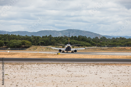 Faro, Portugal - July, 2018: Airliner from Ryanair takes off from Faro international airport FAO during daytime.