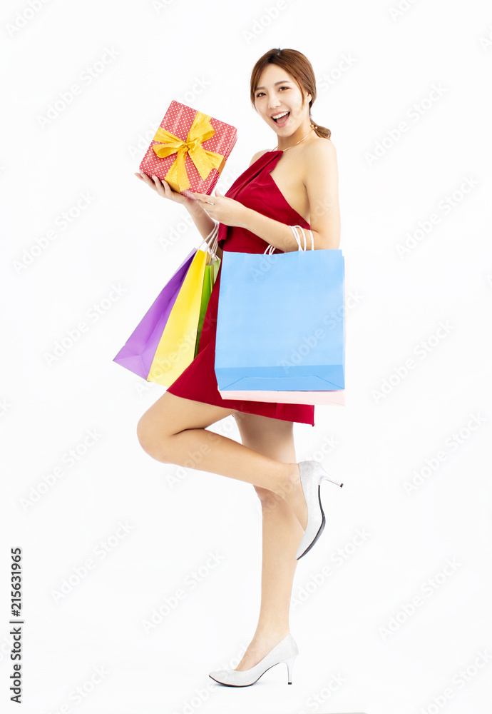 young Woman with shopping bags and gift box young Woman with shopping bags and gift box