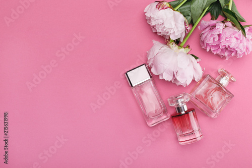 bottle of perfume and peony flowers
