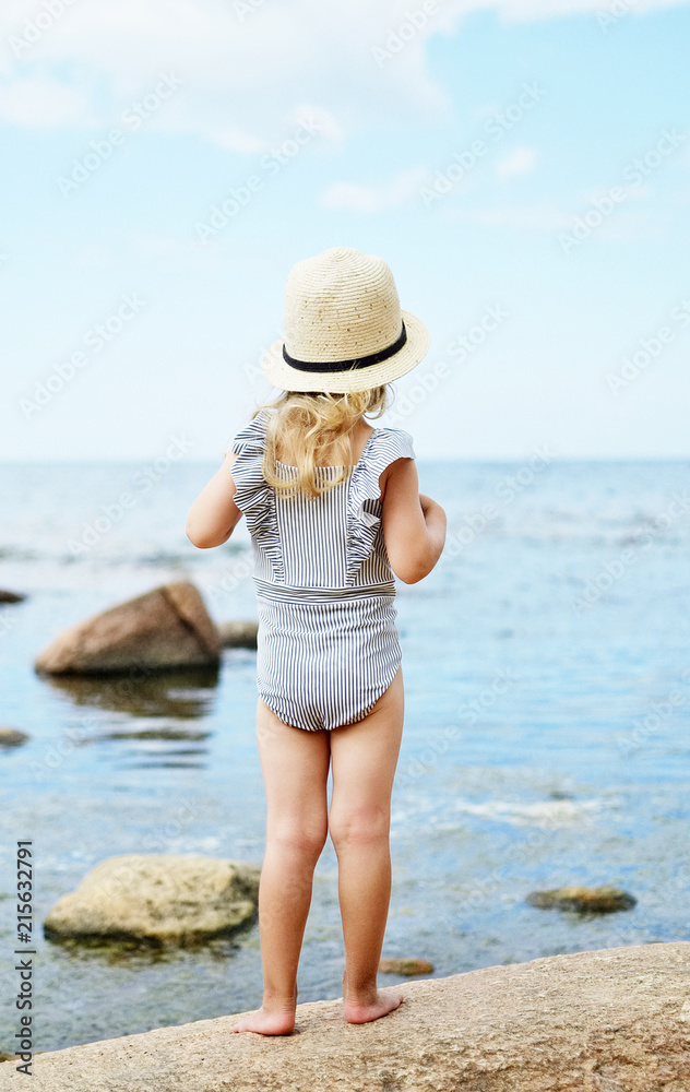 Little girl in hat walking beach sunny summer day, Instagram style, fashion, Latvia, Vidzeme, Baltic Sea