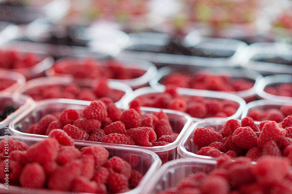 Organic raspberries in boxes at market. Organic raspberries in boxes at market.