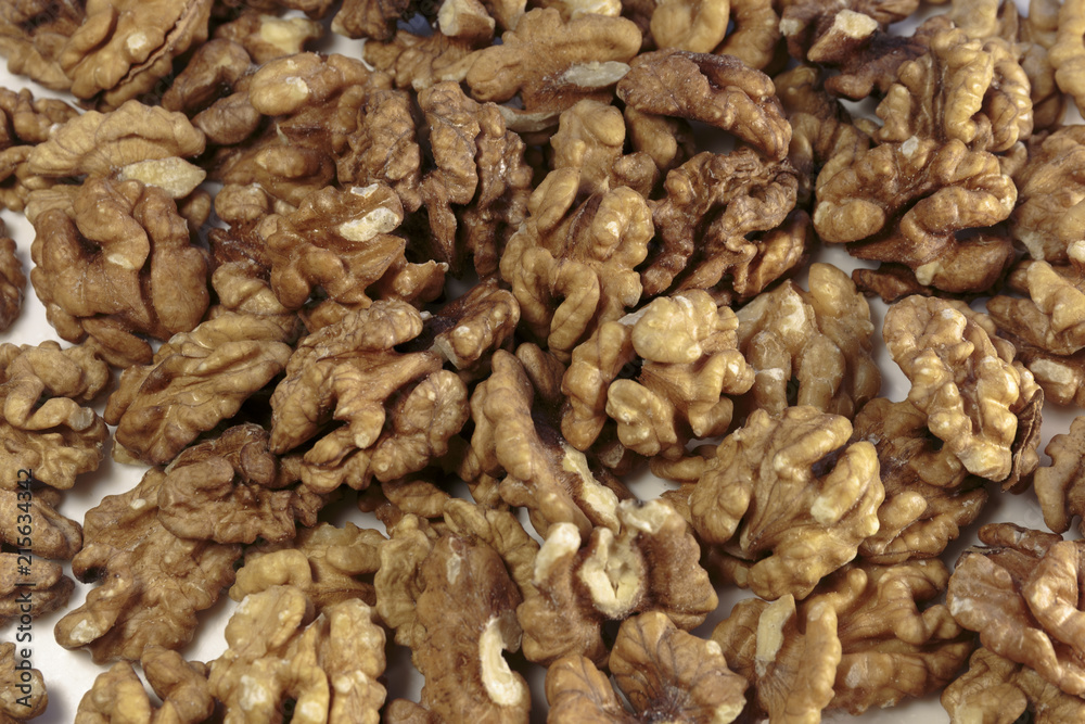 Walnut kernels as concept of vegan food. On white background. Walnut kernels as concept of vegan food. On white background.