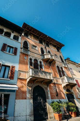 Wide angle view of traditional Venetian-style architeture close up on building facade