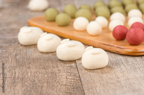 The cooking step of making Japanese Dango dessert with 3 different color in pink(red), white, and green, recipe, hanami Dango, tsukimi Dango, copy space photo