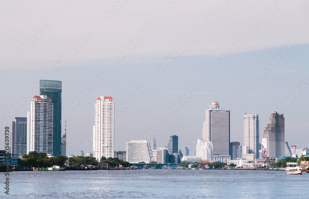Bangkok cityscape with high ris ebuildings seen from Chao Praya River