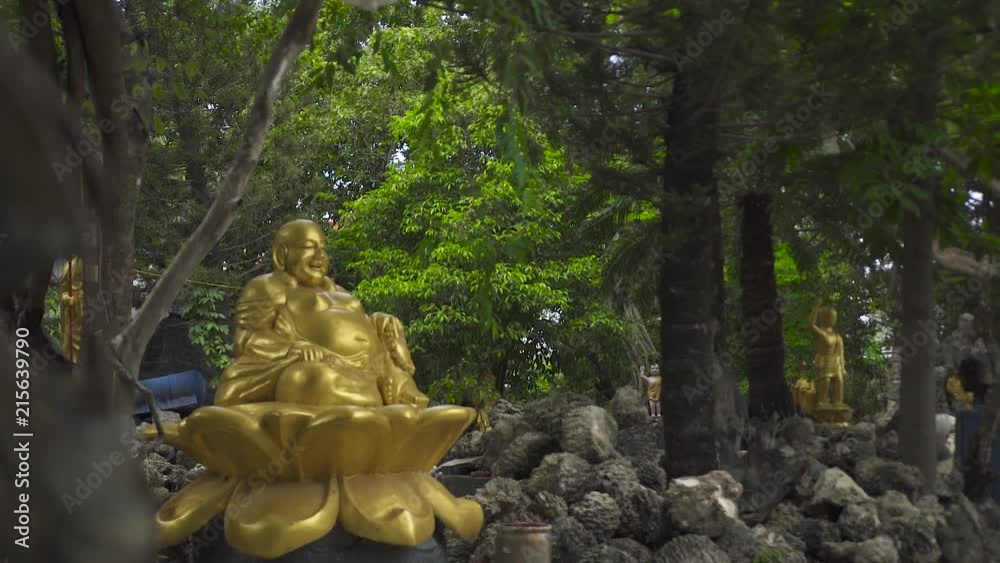 Golden statue god Hotei Budai outdoor. One of seven gods of happiness, communication, fun and prosperity in Japanese mythology Golden statue god Hotei Budai outdoor. One of seven gods of happiness, communication, fun and prosperity in Japanese mythology