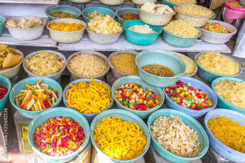 Blue bowls filled with various kis o pasta sold loose in an Indian vendors shop