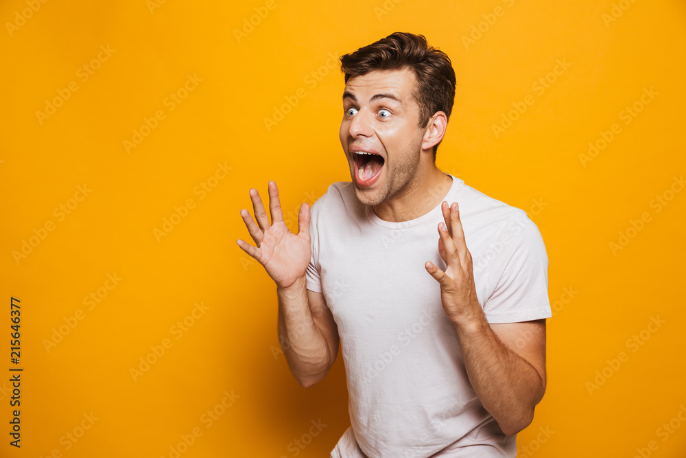 Portrait of a happy young man celebrating Portrait of a happy young man celebrating