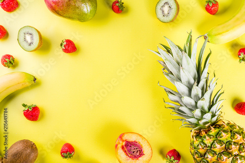 Various tropical fruit background pineapple, banana, mango, strawberry, apples, peach, nectarine, creative layout copy space top view