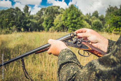 hunter with a gun on the steppe