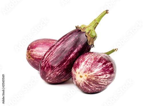Three purple eggplants