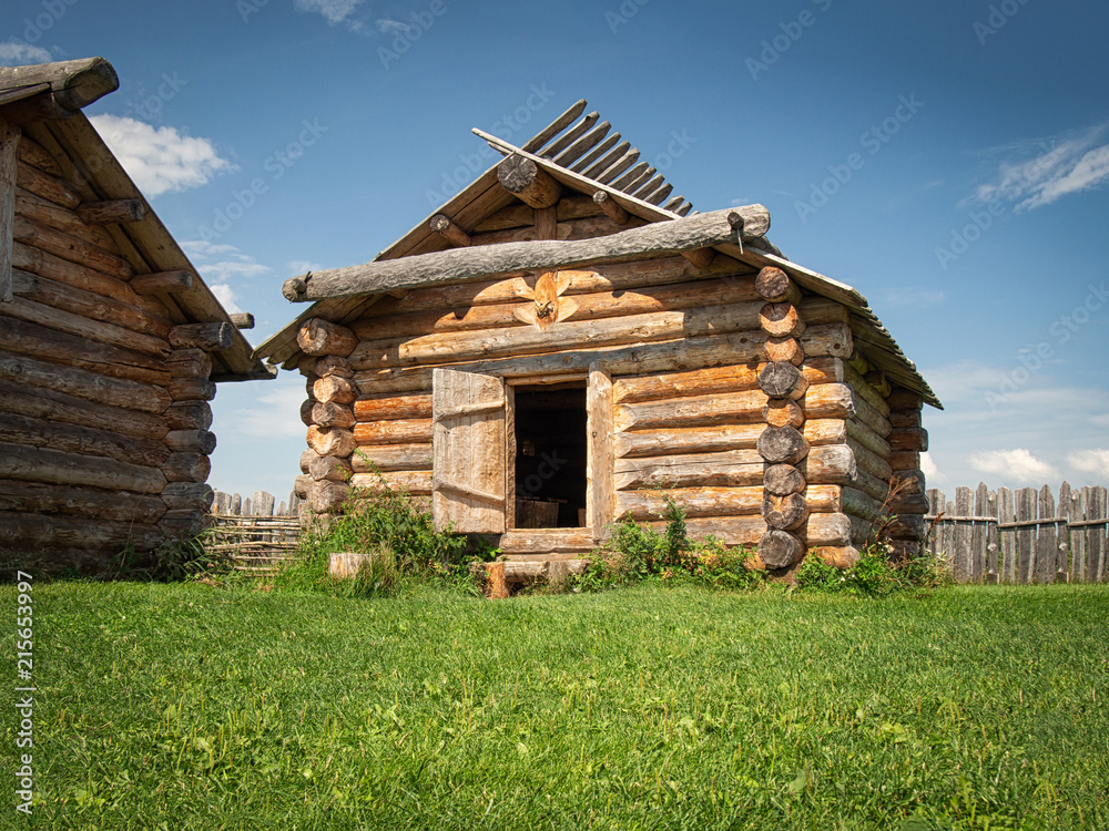 Ancient log house in a country side in a sunny day Ancient log house in a country side in a sunny day
