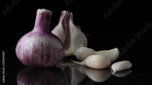 Delicious beautiful garlic on black background. Frame. Concept of a healthy lifestyle photo