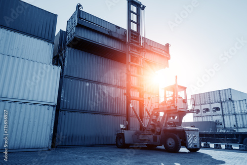 Photography Crane lifting up container in yard