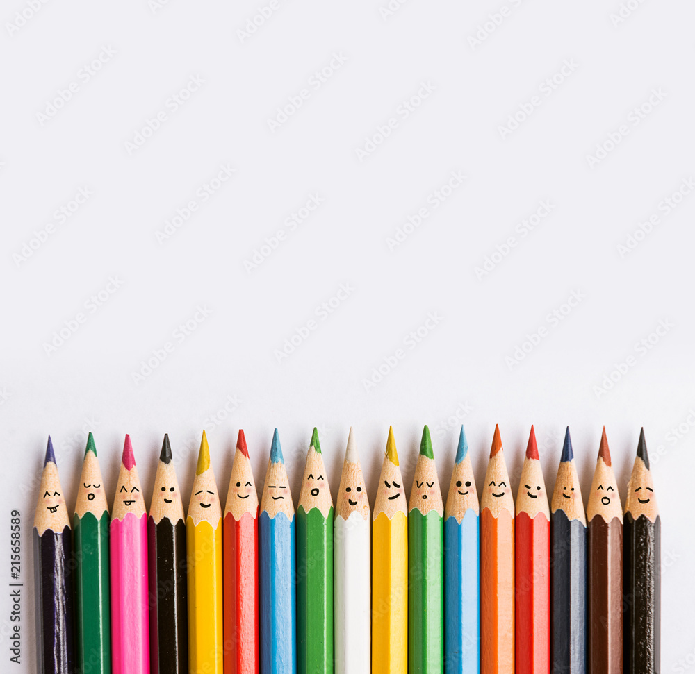 colored pencils on a gray background