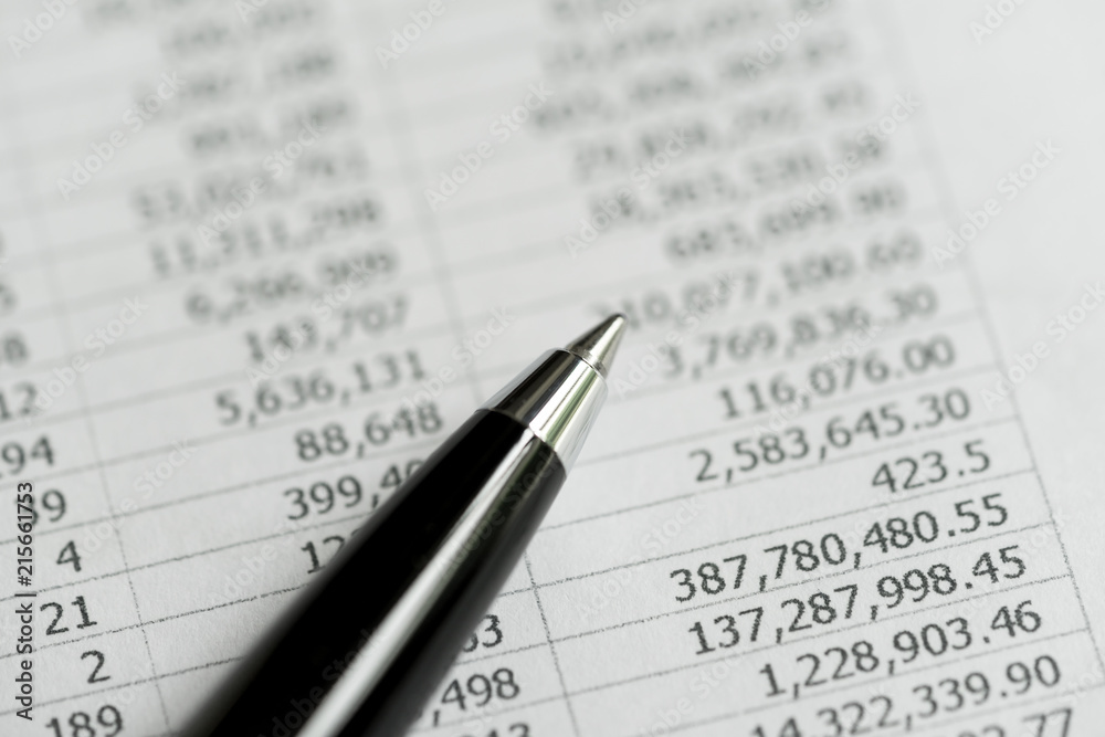 Investment, financial report statistic concept, close-up of black pen on printed stock exchange data price number or valuation table Investment, financial report statistic concept, close-up of black pen on printed stock exchange data price number or valuation table