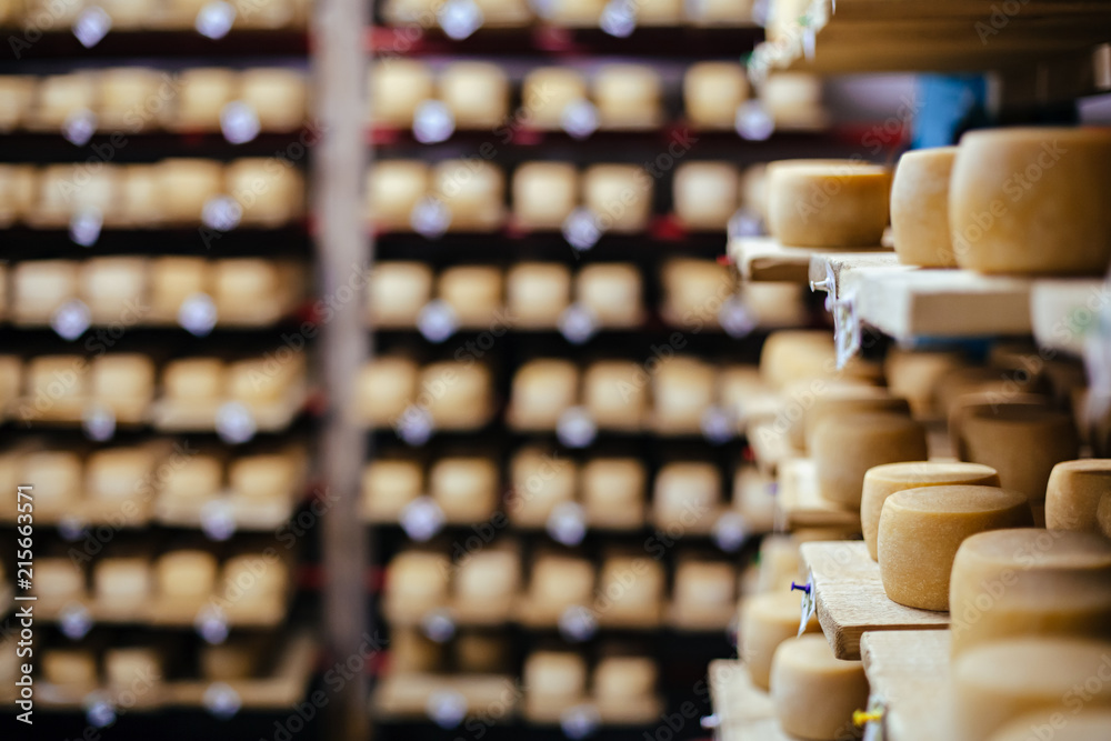 Cow milk cheese, stored in a wooden shelves