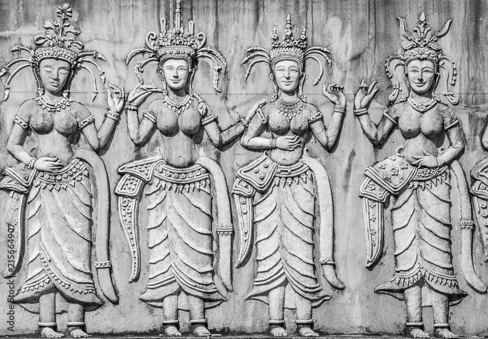 Fototapeta premium Stone status on the wall.