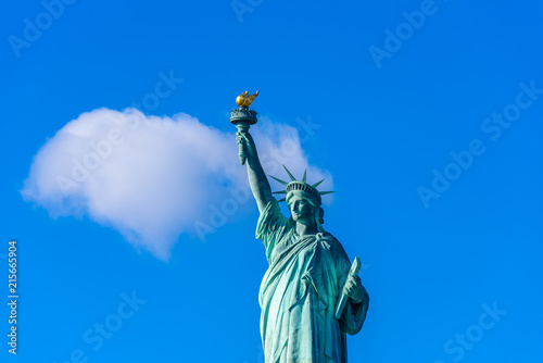 The statue of Liberty at a sunny day with blue sky  New York City  USA