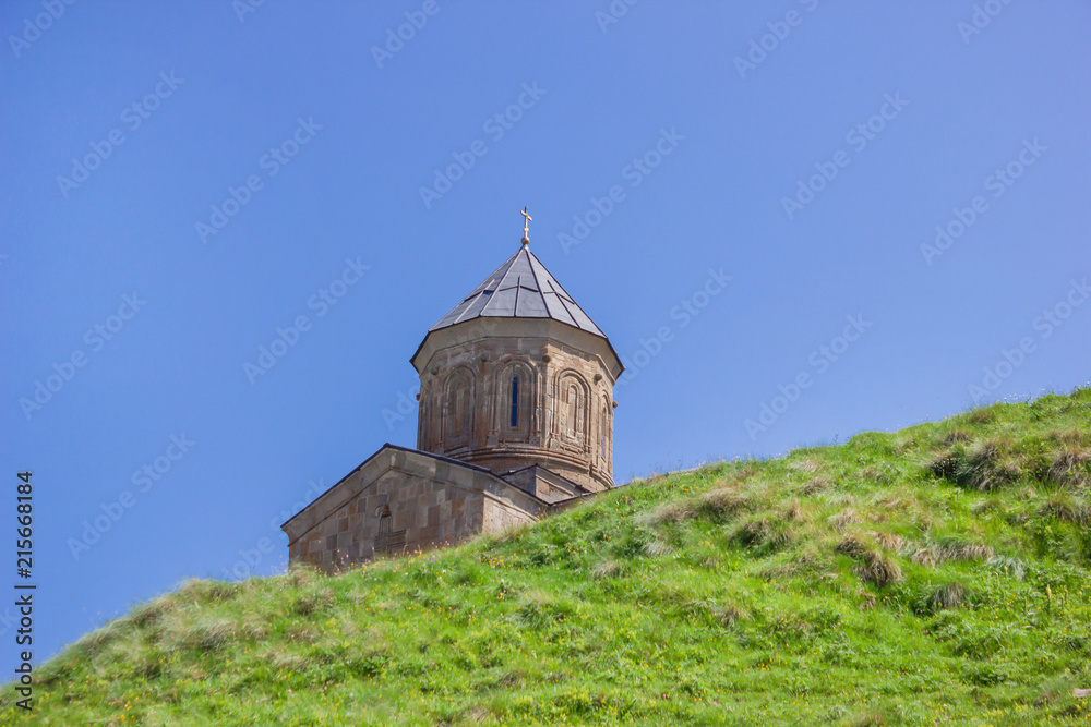 The Gergets church at the foot of the Kazbek mountain