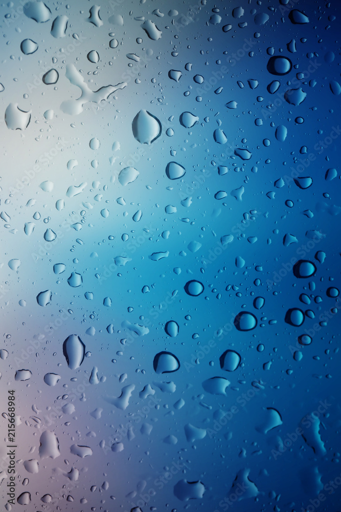 Water drops background.View through the window of strong rainy day ,Shallow depth of field composition and color toned.