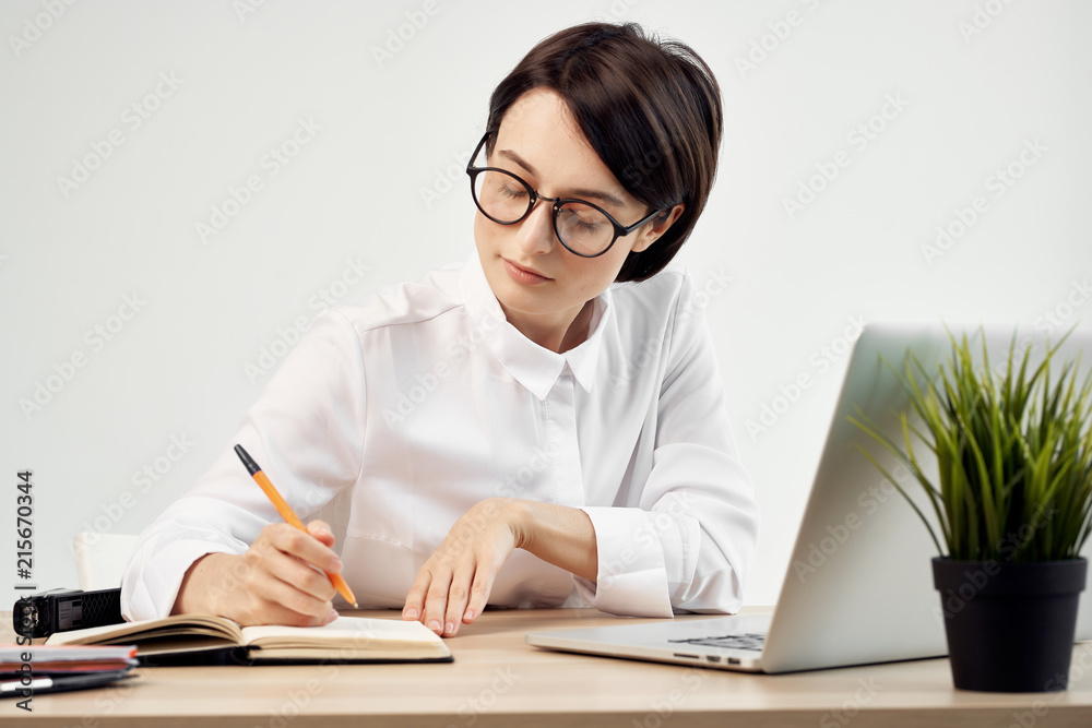 business woman with glasses in the office business woman with glasses in the office