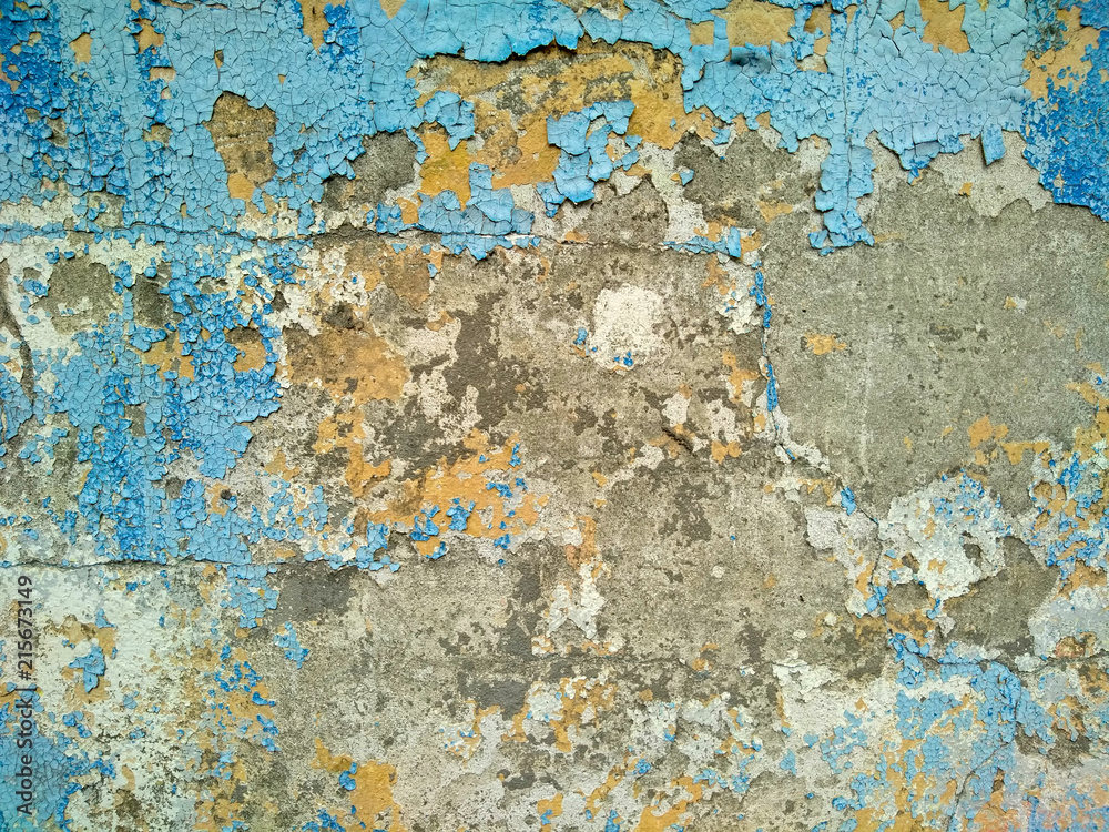 old wall. peeled. blue. yellow. texture. background.