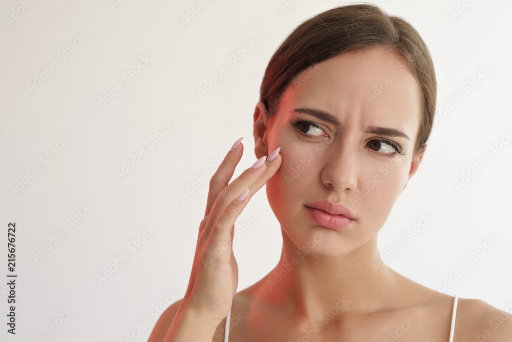 skin care concept. woman unhappy with her skin skin care concept. woman unhappy with her skin