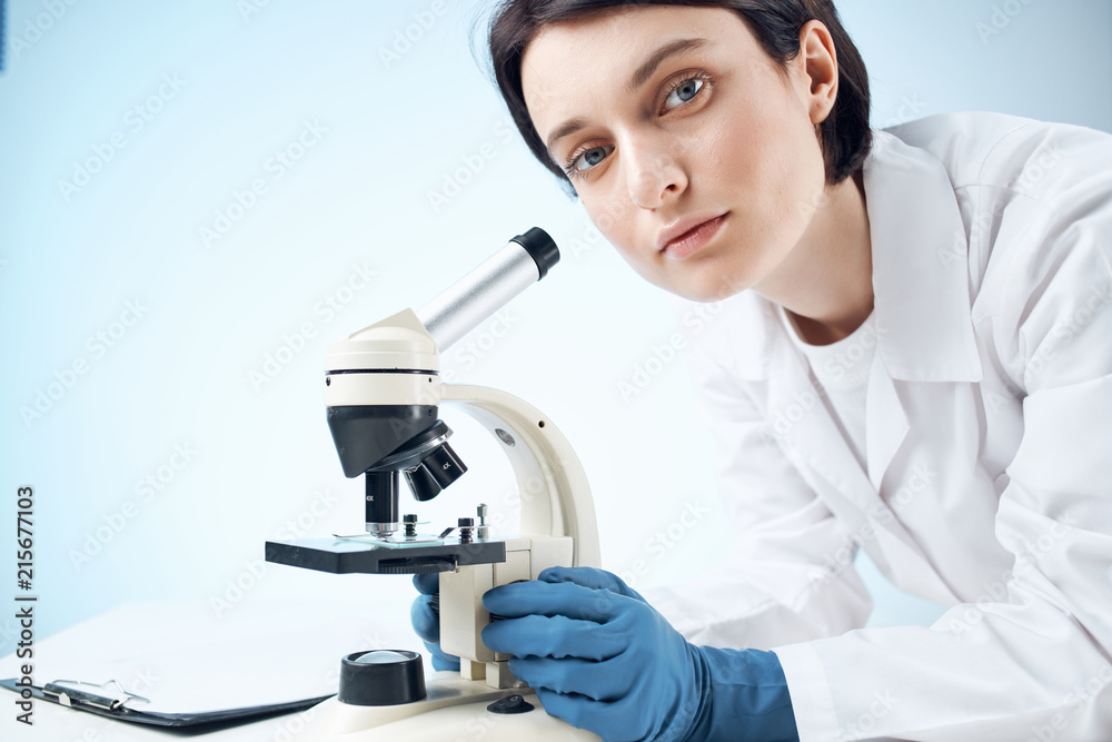 laboratory assistant conducts experiments