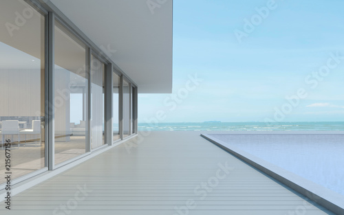 Perspective of modern building with wood deck and swimming pool on sea view background,Idea of family vacation. 3D rendering.