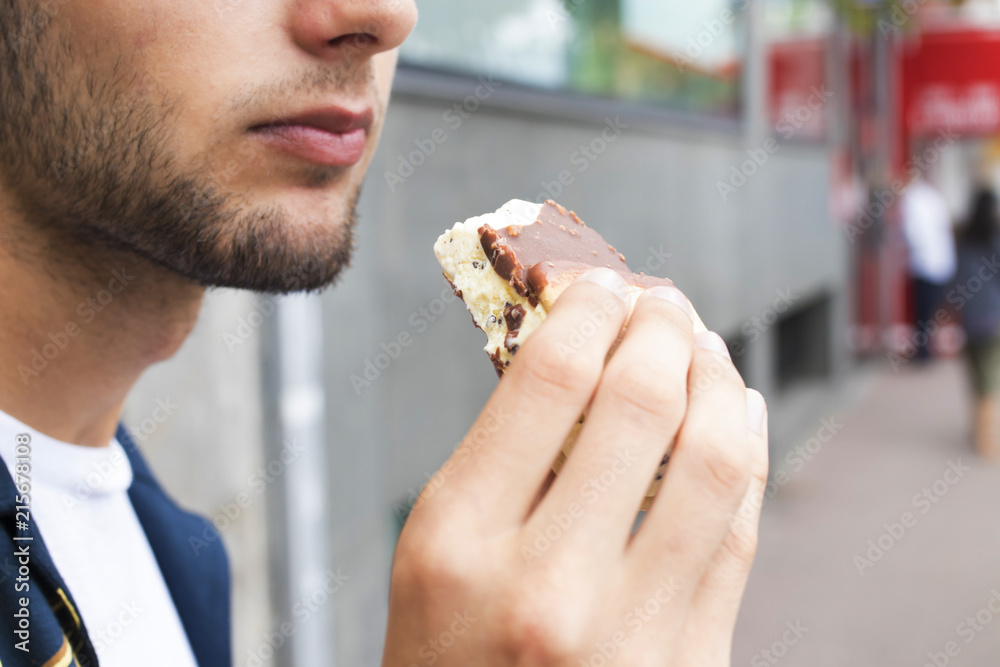 eating ice cream outdoors on the street in summer eating ice cream outdoors on the street in summer