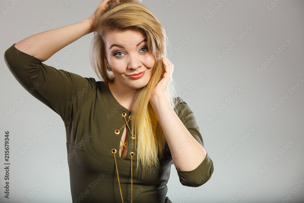 Attractive blonde woman wearing tight green khaki top Attractive blonde woman wearing tight green khaki top