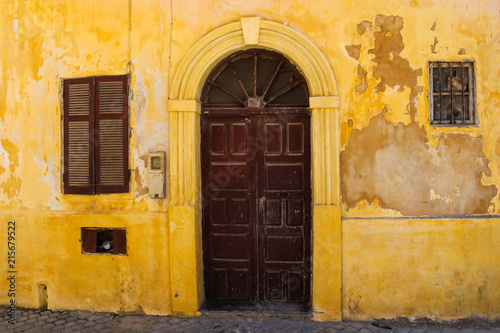 Door of a yellow old house, Morocco © yassmin