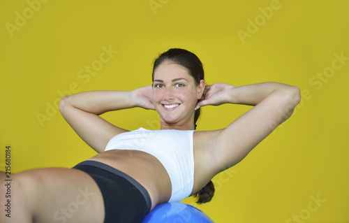 Woman at the gym with a pilates ball